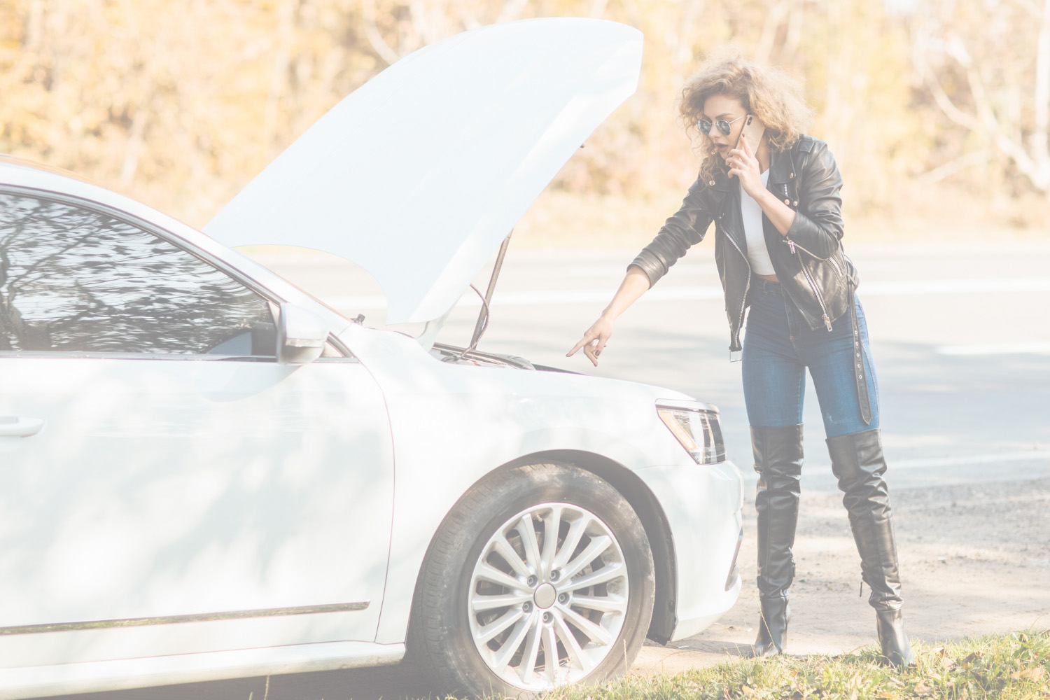 Young woman experiencing car trouble