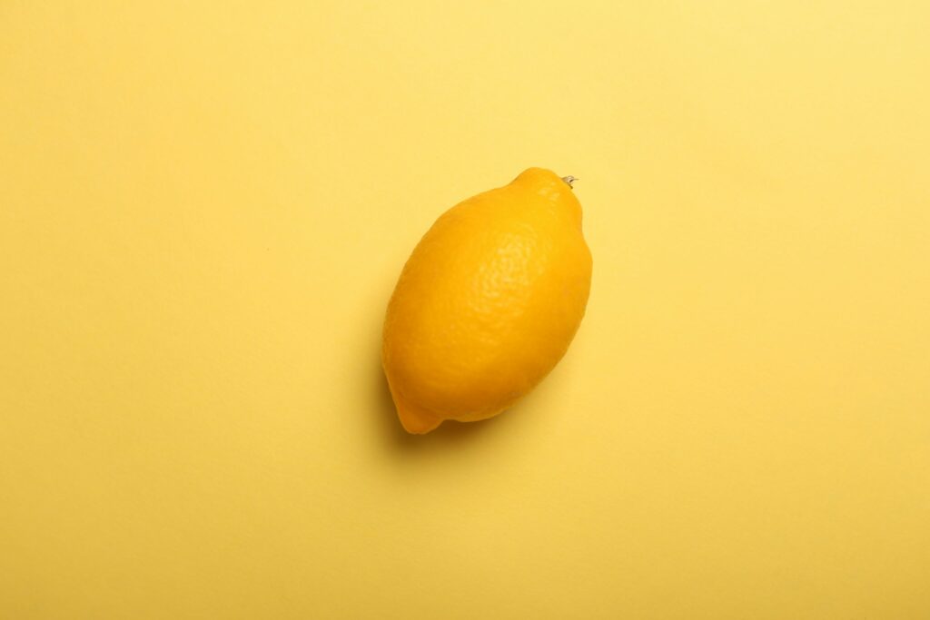 Lemon on yellow background