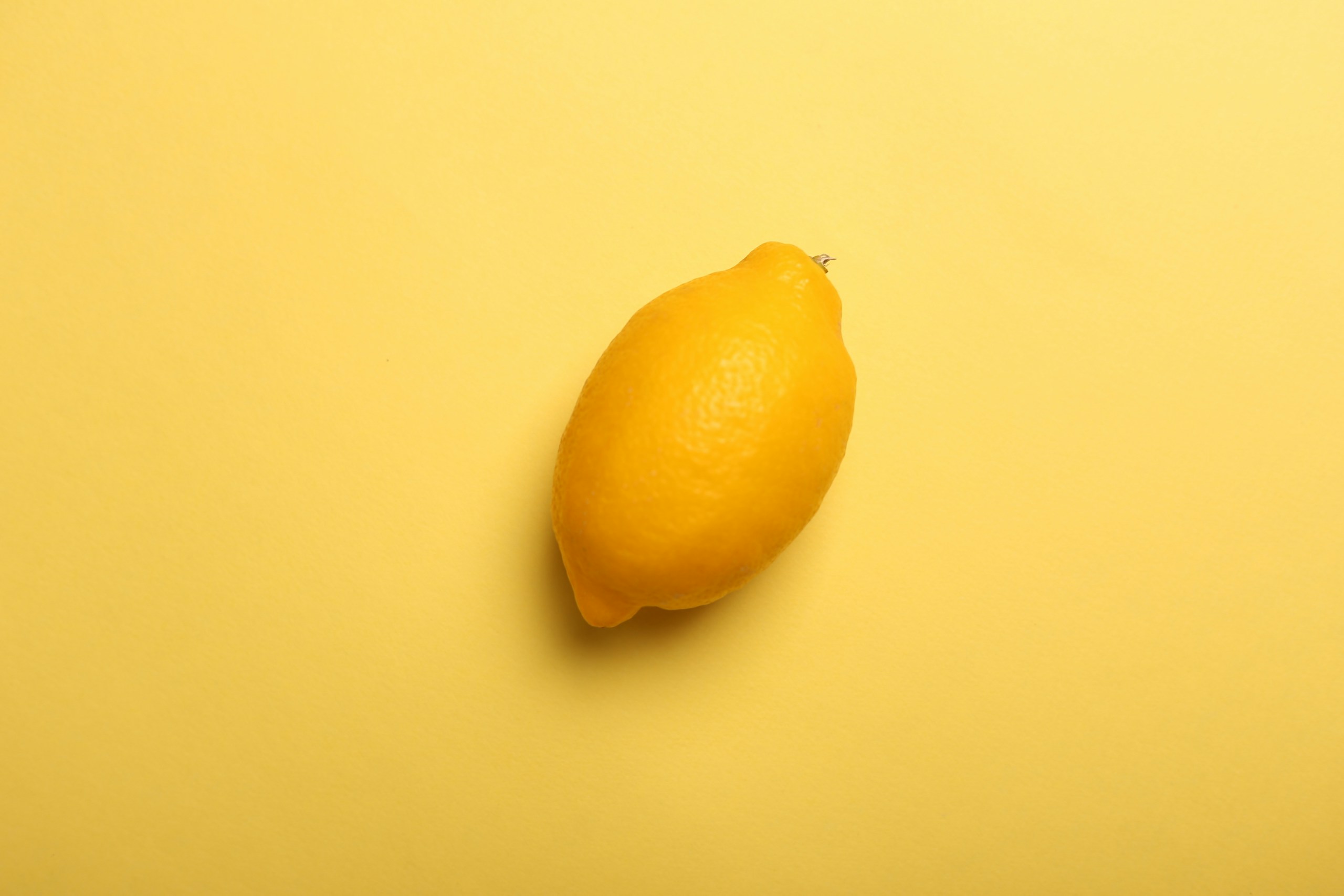 Lemon on yellow background