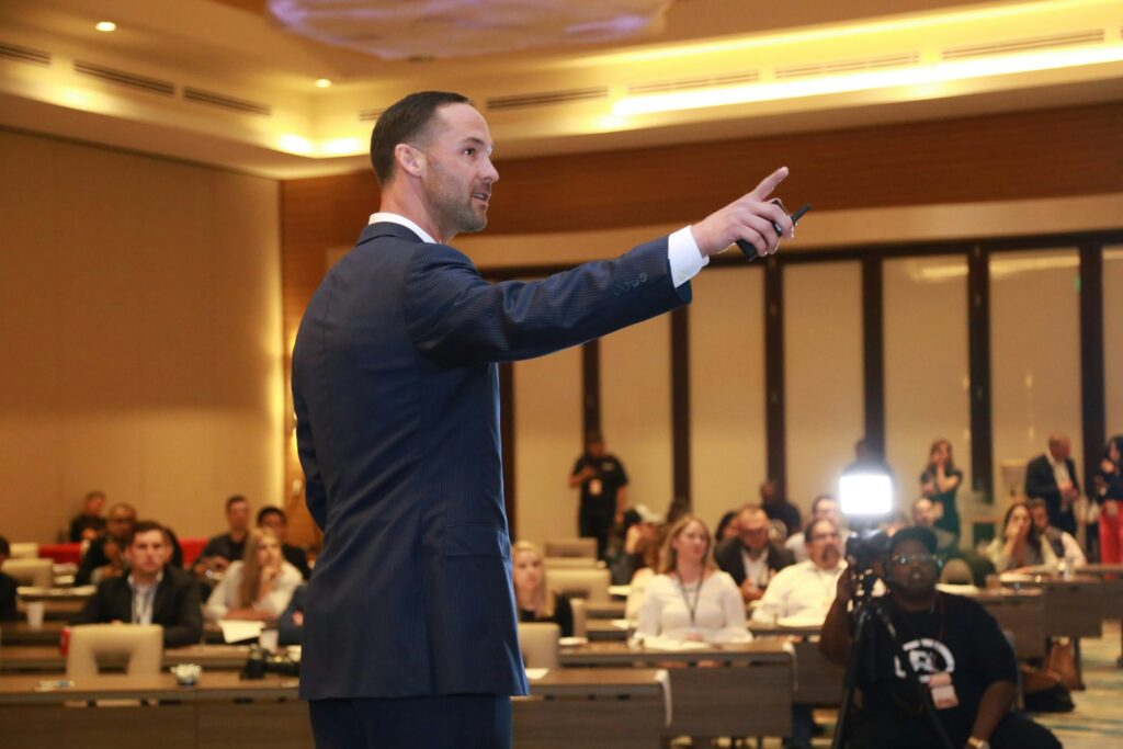 San Antonio Web Design - Jeremy McGilvrey on stage, presenting solutions for business owners. DISCLAIMER: These photos cannot be used in any inappropriate, defamatory, or copyright-violating manner. To inquire about our services, visit: https://www.jeremymcgilvrey.com.