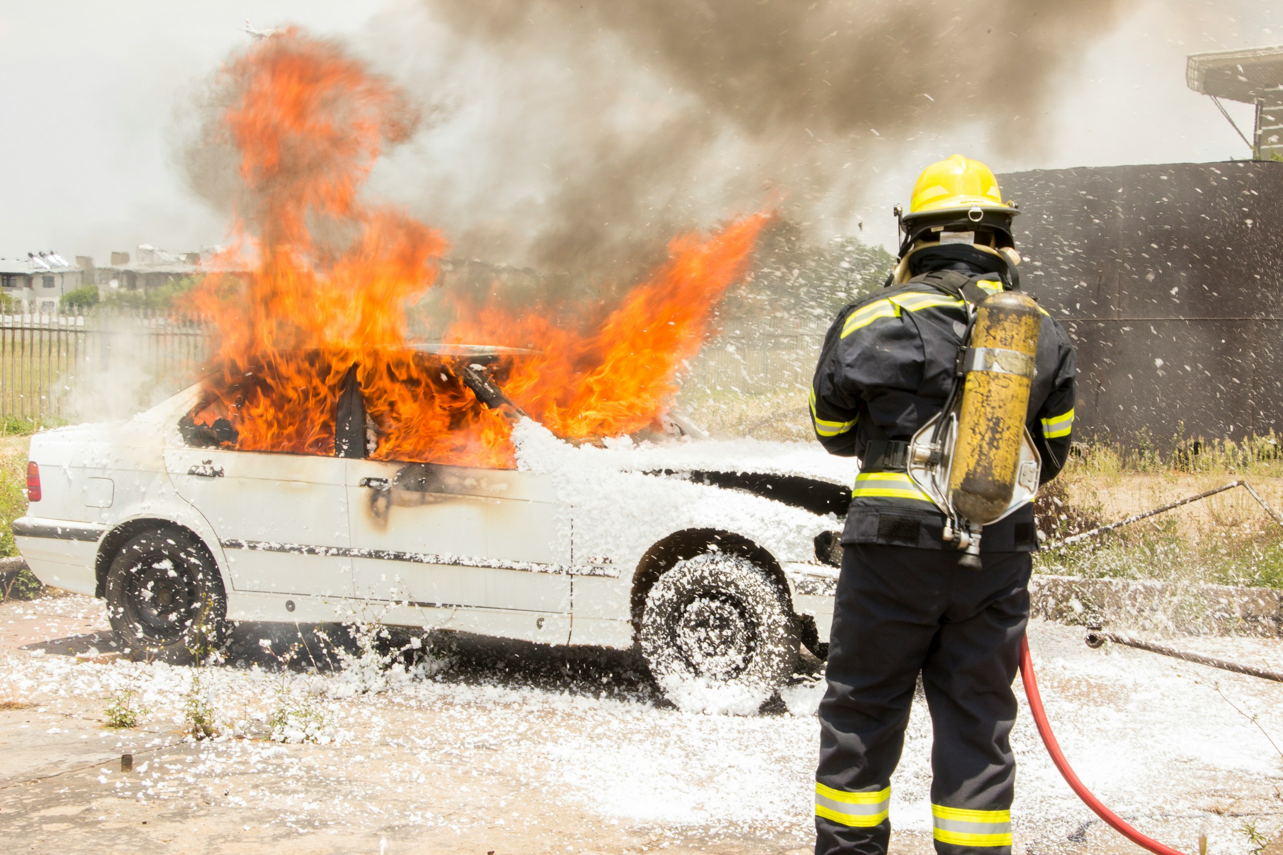 A fireman putting out a controlled fire