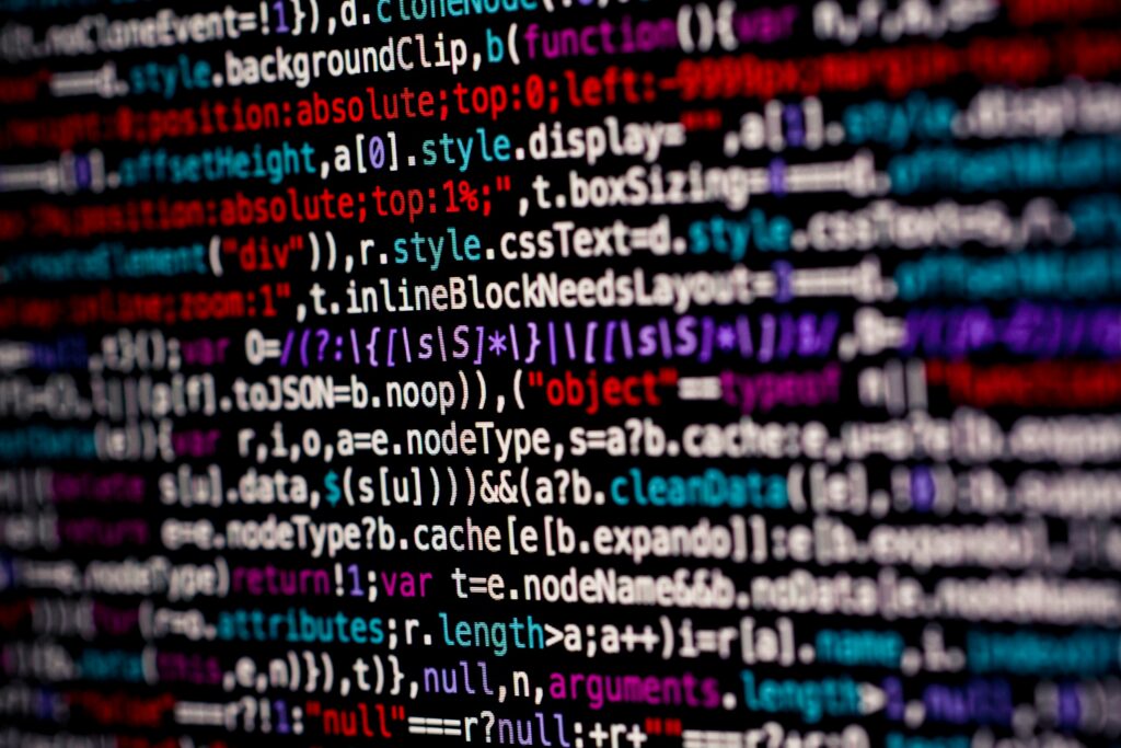 Close-up of multicolored programming code on a screen with syntax highlighting.