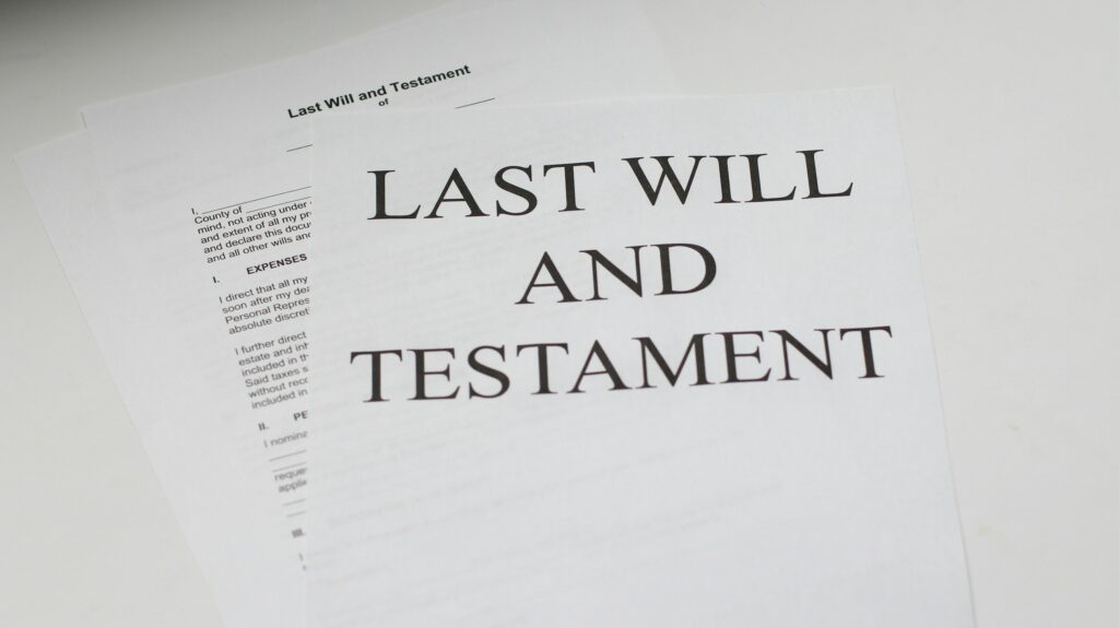 Close-up of a legal document with the words LAST WILL AND TESTAMENT in large type on white paper. (Informative image)