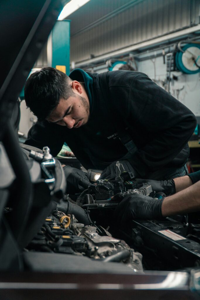 Mechenic working on a car.