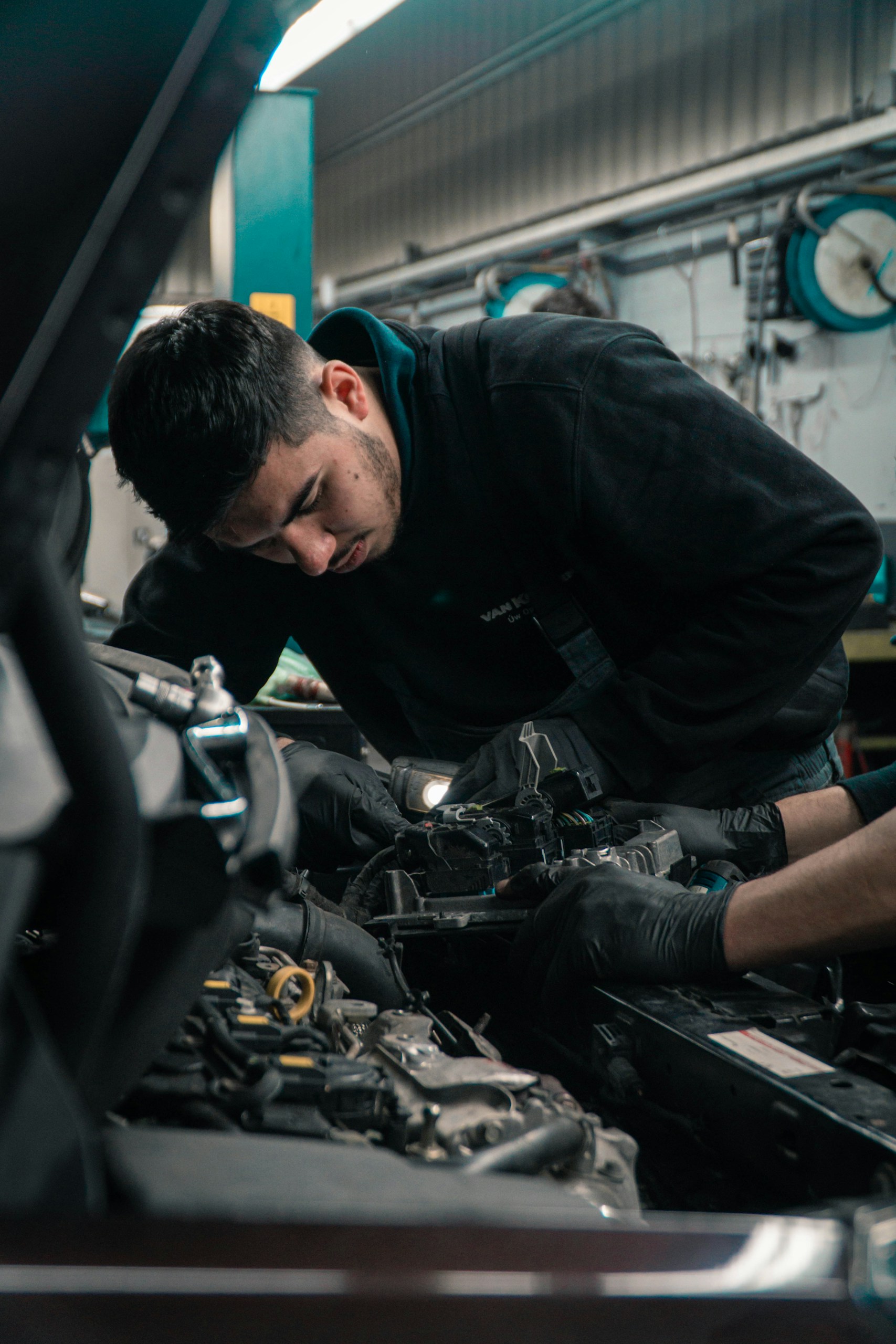 Mechenic working on a car.