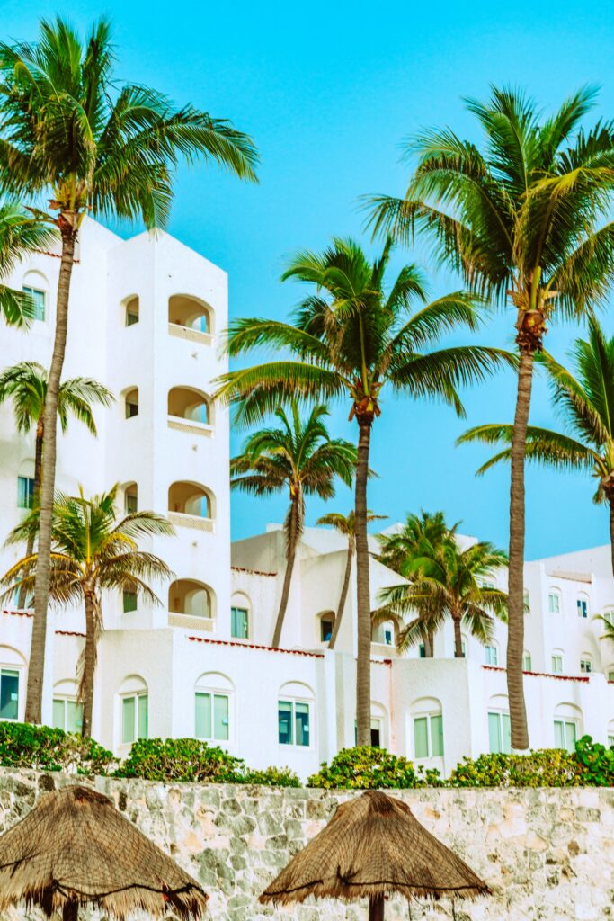 Tropical island hotel with palm trees.