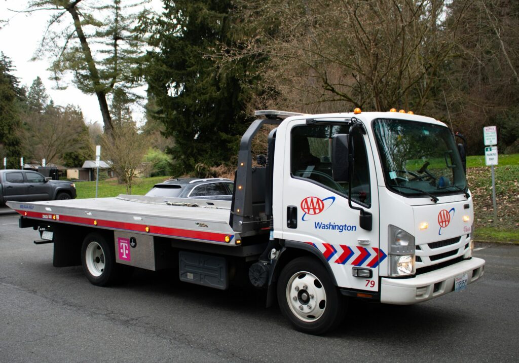 A white AAA tow truck.
